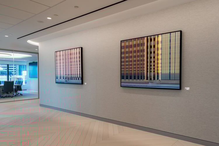 Contemporary photography by local artist in Robinson+Cole's Boston Office. Shane Taremi, "Woman in Blue," and "Joy Ride"